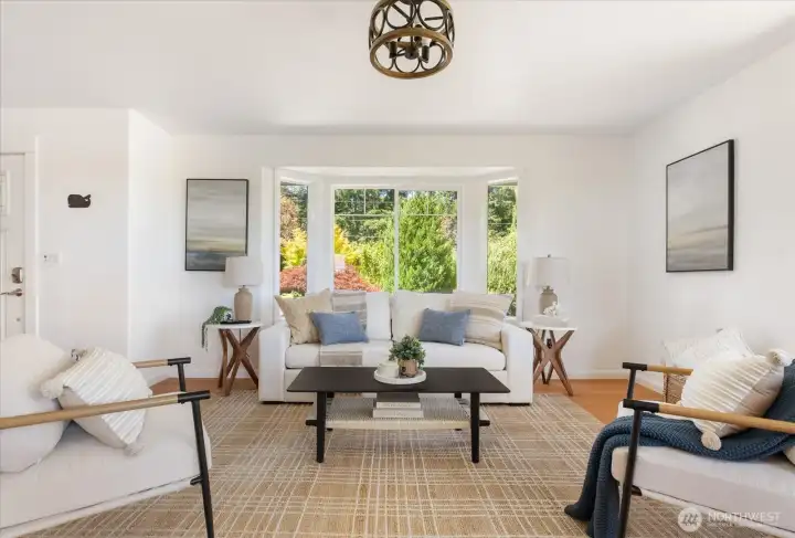 Large living room with bay window to the left of the front door entrance Large living room with bay window to the left of the front door entrance