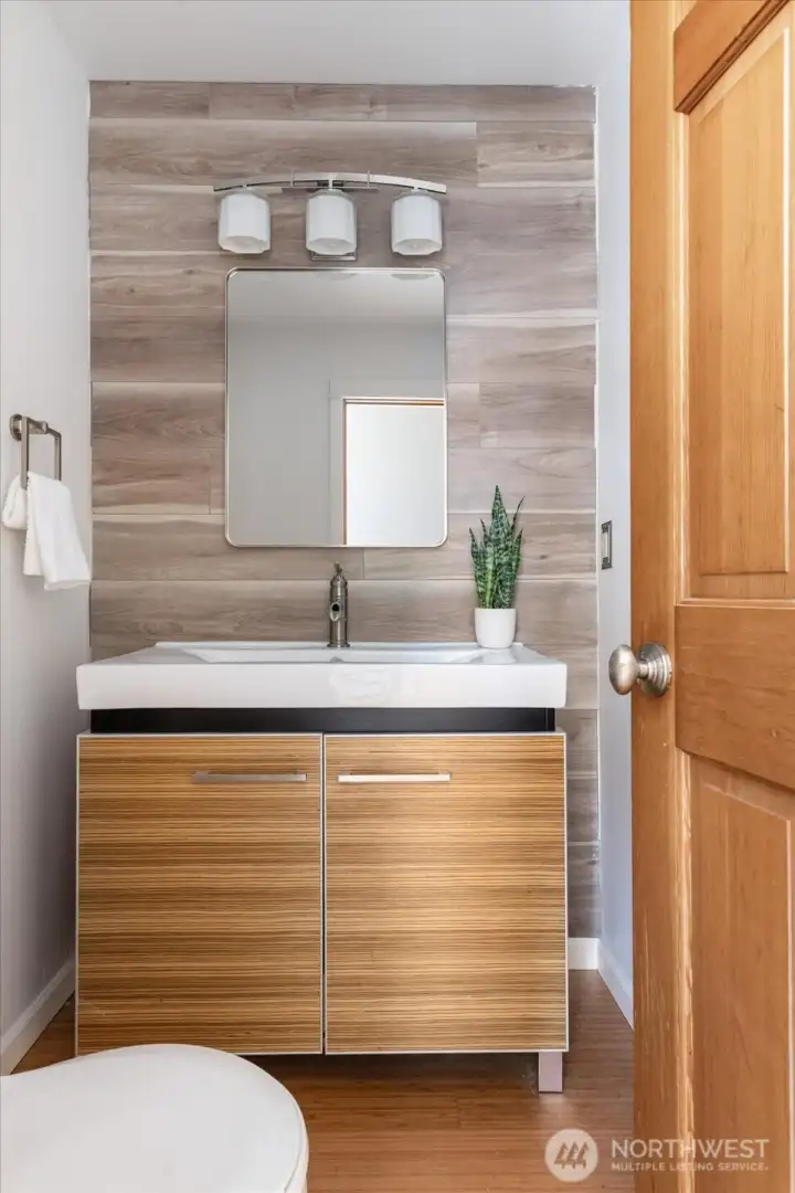 Powder room perfectly located in the center of the main floor, update with stylish finishes. Powder room perfectly located in the center of the main floor, update with stylish finishes.