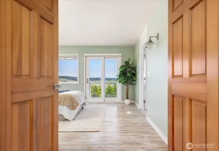 Welcome to your spacious primary suite with private balcony for the best views in the house Welcome to your spacious primary suite with private balcony for the best views in the house