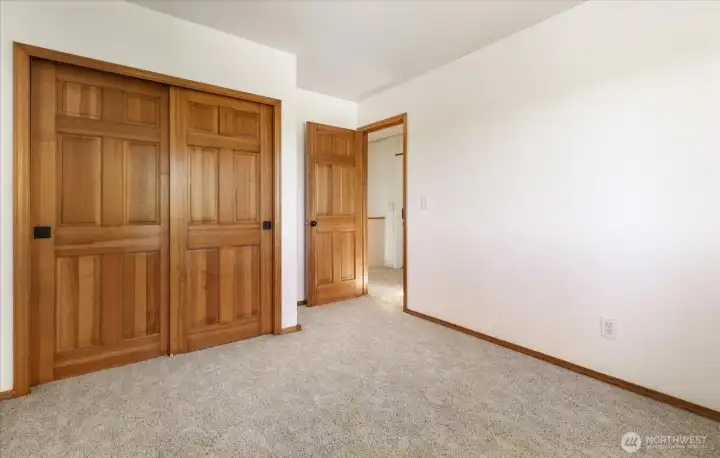 2nd Bedroom upstairs, with solid wood closet doors 2nd Bedroom upstairs, with solid wood closet doors