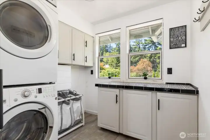 Sunny laundry room with lots of storage and folding counter Sunny laundry room with lots of storage and folding counter