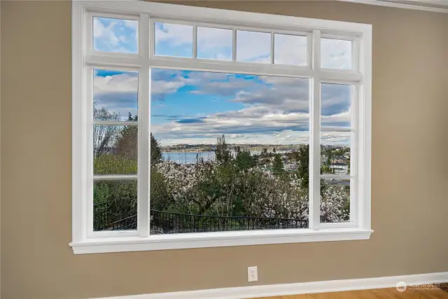 The picture window in the dining room with views of the Bay and the delights of the home's treasured trees.