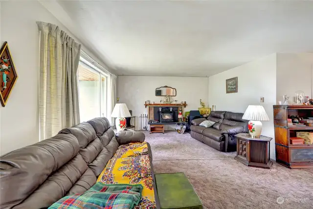 Upon entering, step into a large living room with wood stove.
