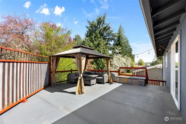 Back deck with gazebo and outdoor sofa with table