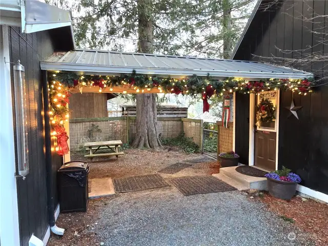 Super cute covered courtyard leads from home to laundry facility.