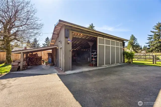 768 sq ft detached garage w/ shop space & attached carport. The roofline on this building just adds additional storage options.