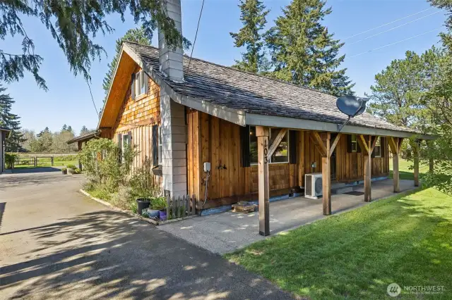 Front of the house that faces the street- the entry door that leads into the family room is located on the covered porch side of the house.