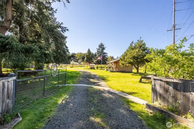 Private property with gated entry & driveway that wraps around to the house.