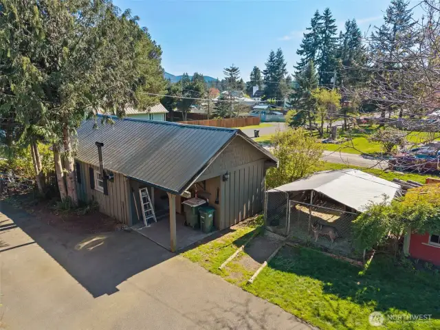 Garage/workshop & dog run are just across the driveway from the house.