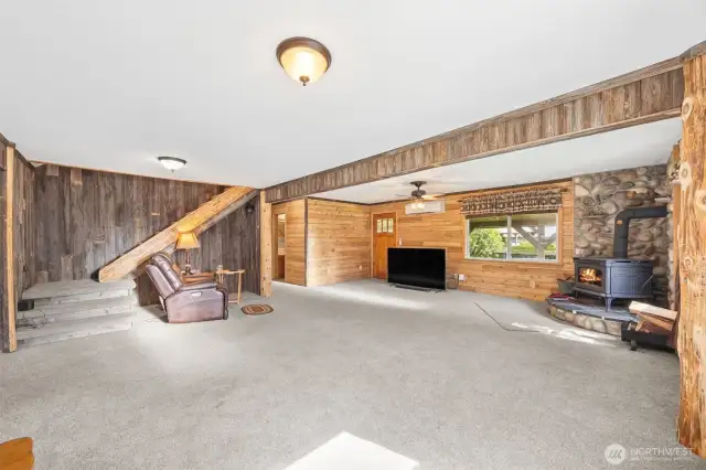 Large family room is centrally located in the heart of the home- a warm free standing stove will help keep cost low in the winter months.