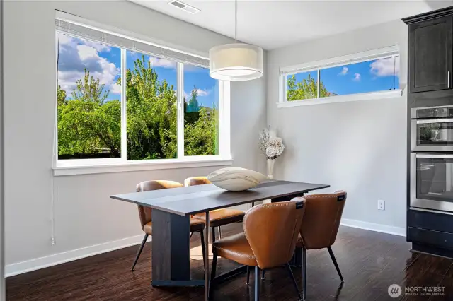 Dining area next to kitchen and Living, opens to Backyard w slider door