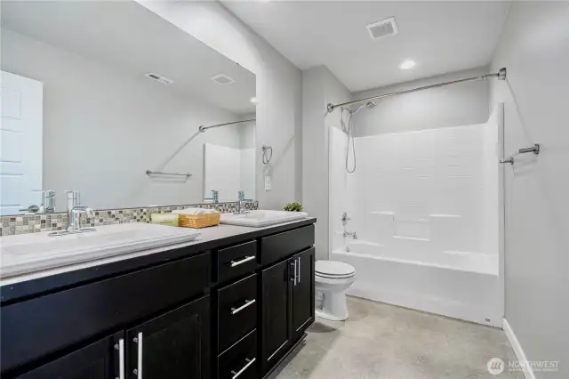 Hall way bath w shower tub combo and double vanity
