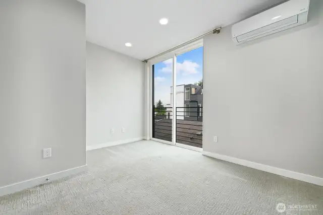 Primary bedroom with Juliet balcony and AC