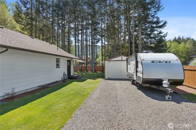 Shop is behind trailer with 2 bay doors and 1 man door.