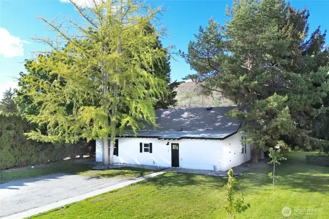 A view of the home from the Gibson side - a large driveway and lawn offer plenty of space.