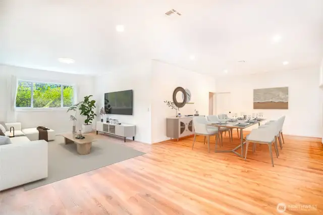 The living and dining areas are designed for a fluid and open feel.
