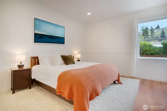 Master bedroom easily fits a king-sized bedroom set and looks into the backyard.