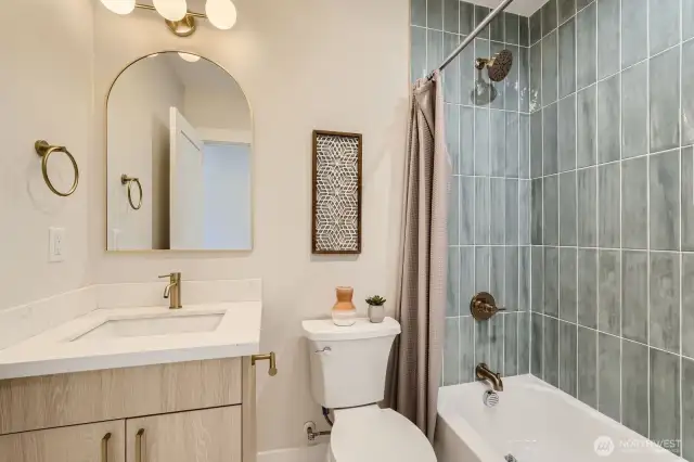 Full bath with tub/shower combo.