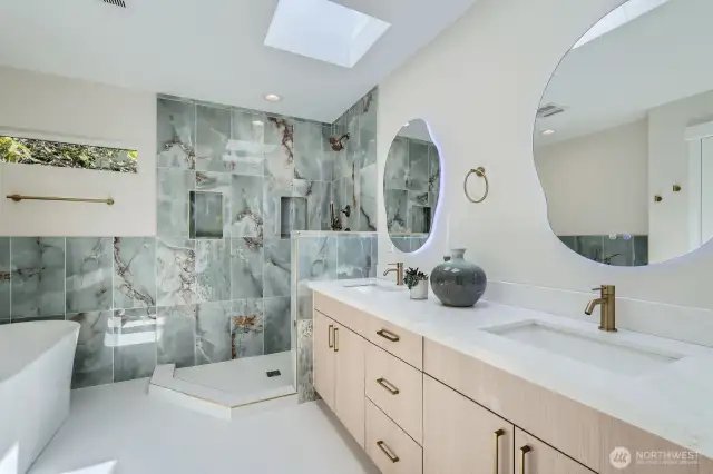 Another view of the primary bath with a dual sink vanity.