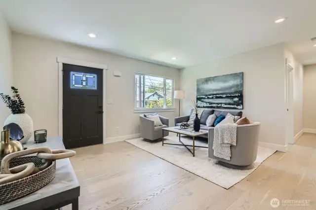 Engineered hardwood floors flow throughout the main living areas.