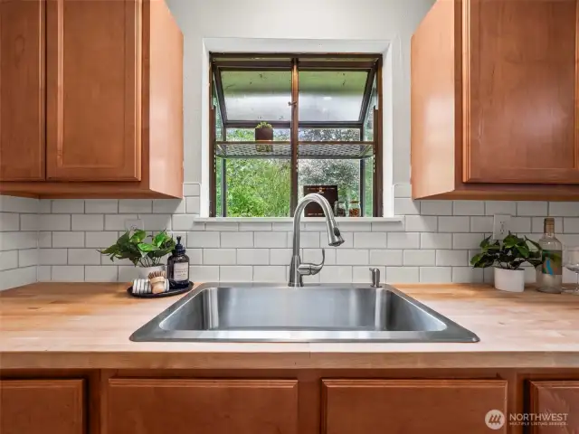 The kitchen sink was replaced with the counter tops and you have a great view overlooking the large back yard.