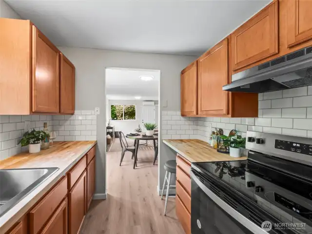 This view from the kitchen out shows how you can be in the kitchen but also still remain part of the home. It is a galley ktichen but the orientation. allows you to be part of the living spaces.