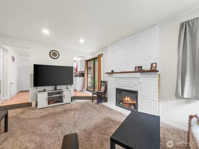 Unit number one has the similar orientation as the other unit but has en enclosed wall separating the living room and kitchen.