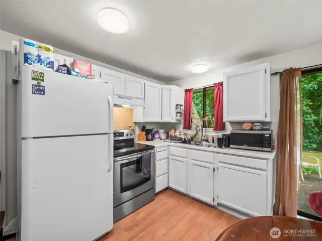 The kitchen in unit one is not as updated as unit two but features a very similar layout and plenty of counter space.