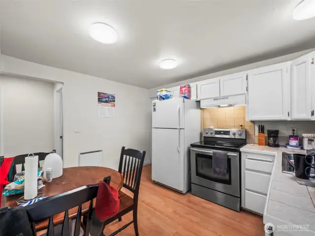 Enough room to cook and have a pub table without interfering the flow of the space.
