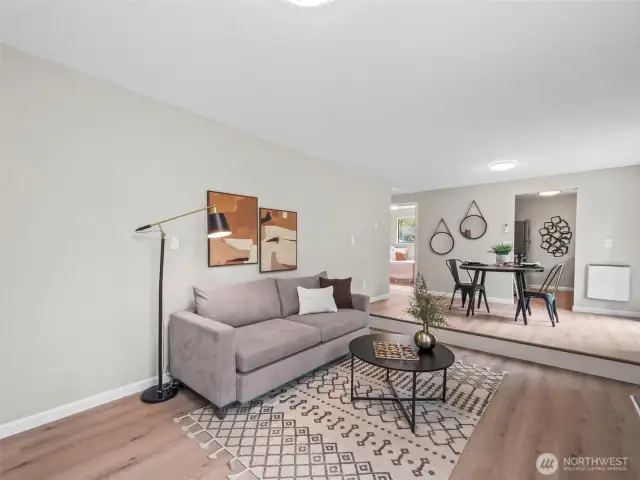 The living space is right upon entry and connects a small dining area with the kitchen.