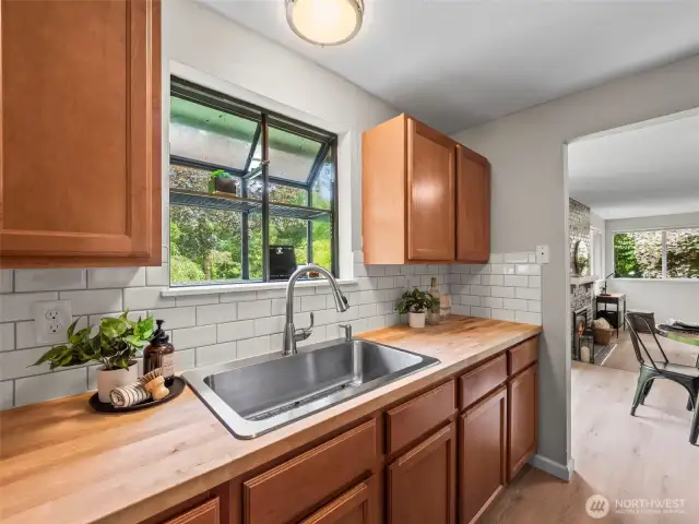 Overlook the large backyard of this duplex. You also have a garden window for growing herbs or any type of plants.