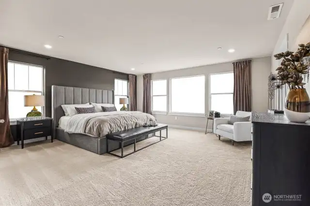 Giant primary bedroom with large windows with windowsills letting you wake to the morning sun. Photo is representational. Actual home is under construction and finishes will vary. See site agent for details.
