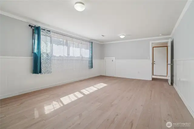 Rec-room with vinyl plank flooring could be bedroom as well