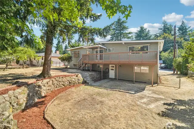 Back of home with terraced yard.