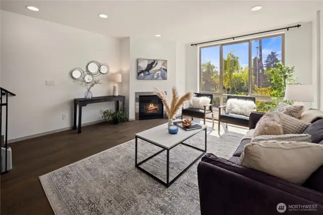 Large living room with gas fireplace and large windows