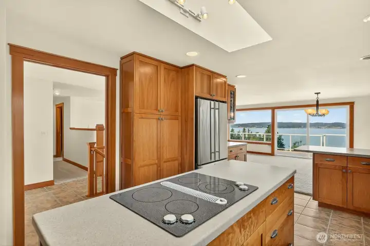 Kitchen island with down draft, stainless fridge