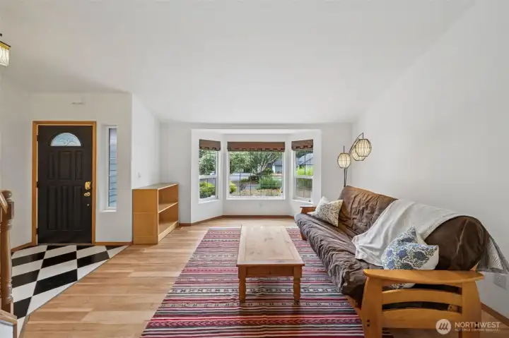 Formal living room with cathedral ceilings
