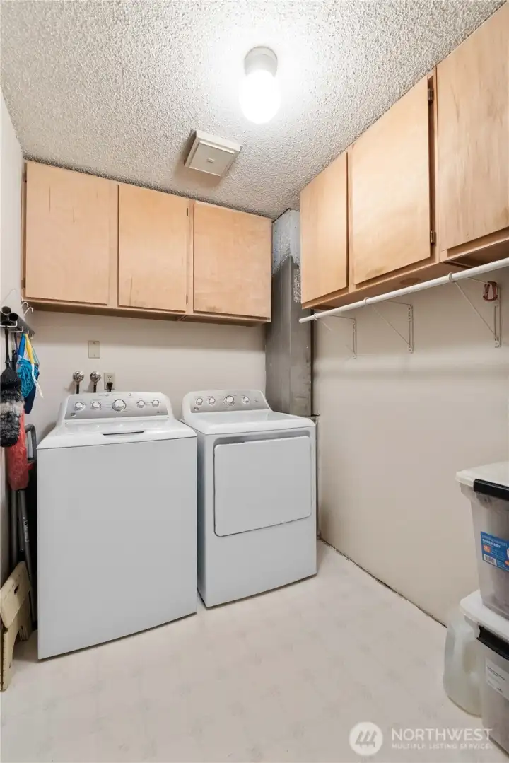 The Laundry offers lots of storage options with a plethora of cupboards.  You'll also pass through here to access the garage and basement area.  Washer & Dryer DO NOT CONVEY