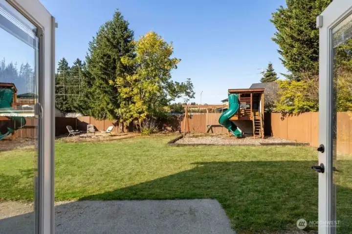 French doors open to the big back yard