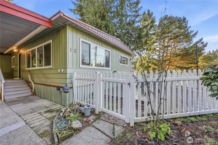 Fencing wraps around to the front.