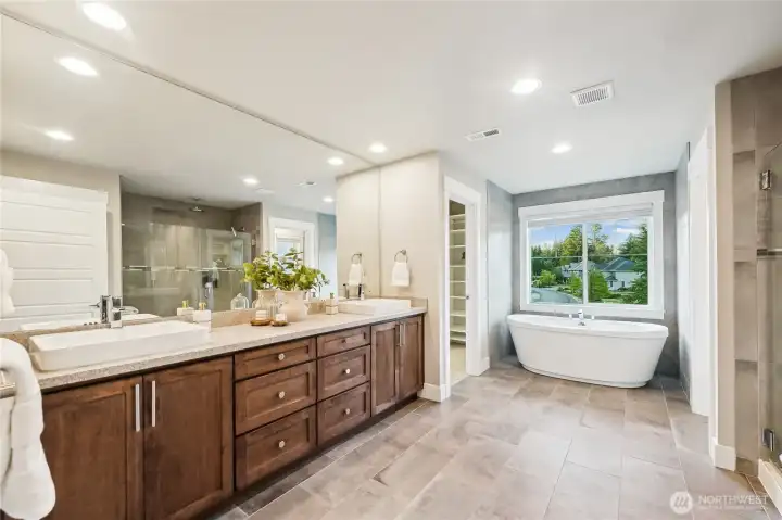 Don't you want to soak in this tub? Double vanities