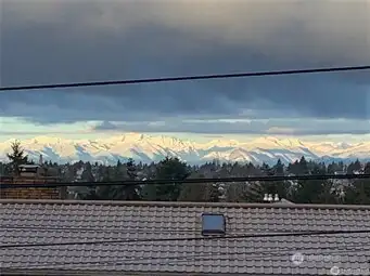 This picture was taken from the house in front on a mountain day. The view from here is similar, without the wires.