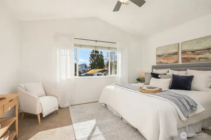 Vaulted ceilings in this gorgeous primary bedroom.