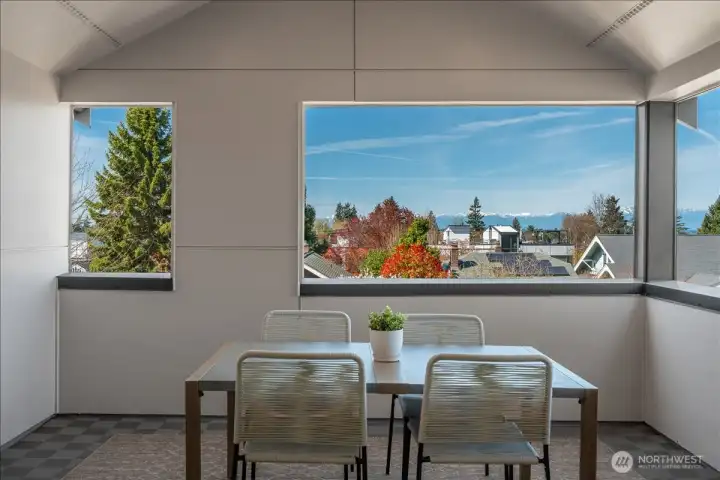 Covered rooftop deck provides year-round outdoor space.
