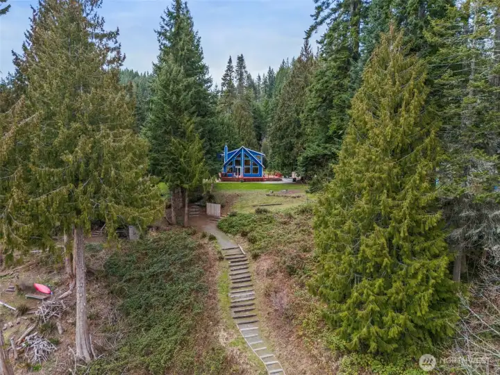 Perched on the banks of Alder Lake - this property offers a retreat of beauty, fresh air, stillness and abundant views that never grow old with the seasons.