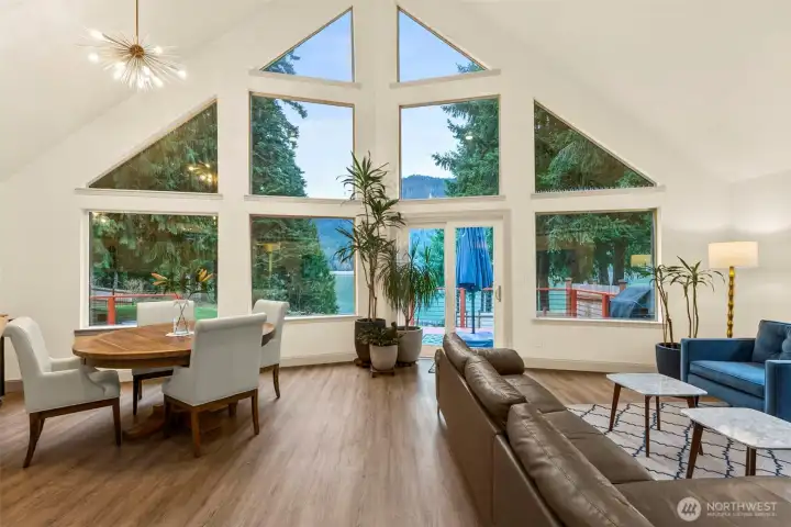 The showstopper view as you turn the corner from hallway into the living room. Open layout for dining and living room spaces offer flexibility on furniture layout and entertaining abilities.