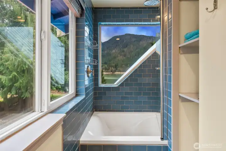Lake views while you relax and soak in this incredible tiled  6ft soaking tub. Plenty of storage and space to move freely.