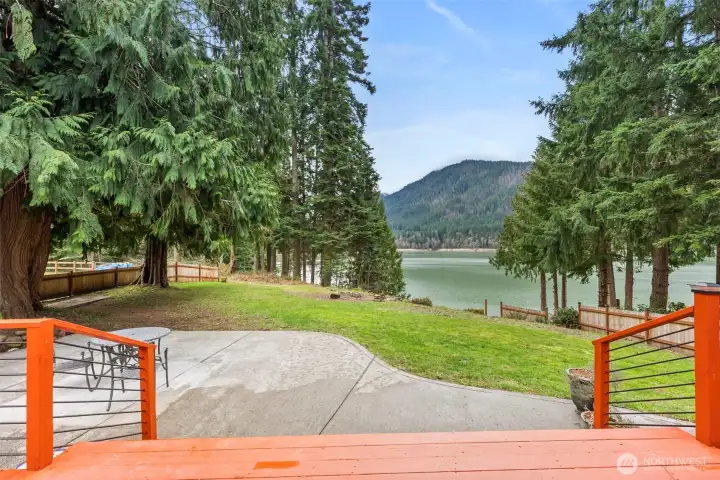 Step out on to the deck with expansive views of Alder Lake and surrounding grounds and forest. Resident eagles and hummingbirds fly around you, as deer pass through  the yard.