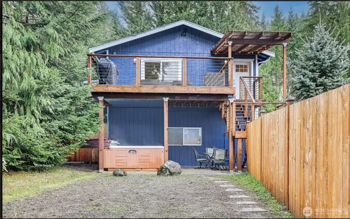 2bed/2 bath DADU located above the detached 3-car garage/shop with walking path down to the lake. Covered hot tub located underneath deck. Laundry room for apartment located underneath decking as well.