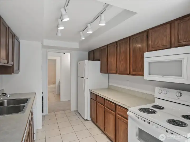 This kitchen is functional, with ample storage and counter space. Move in and plan your dream kitchen. Check out some of the sold units in this building for creative design ideas.